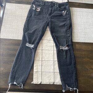 Good American Black Skinny Jeans with Vintage Distressing